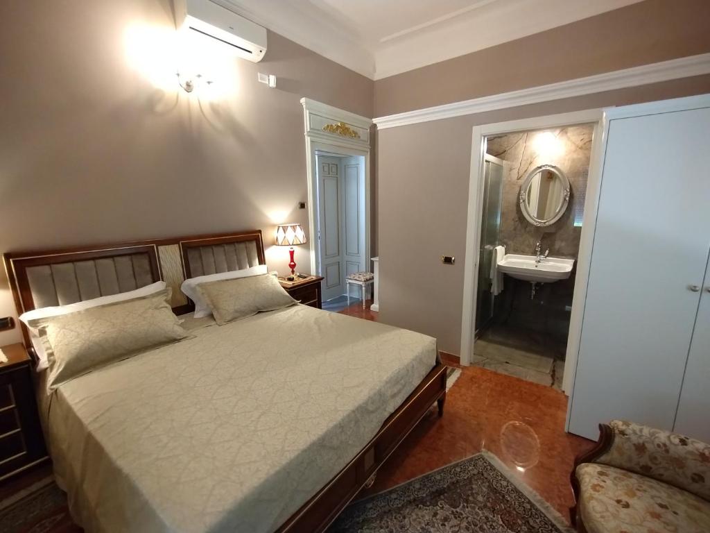 Postel nebo postele na pokoji v ubytování NOBILI LIBARDI - VILLA BASEVI