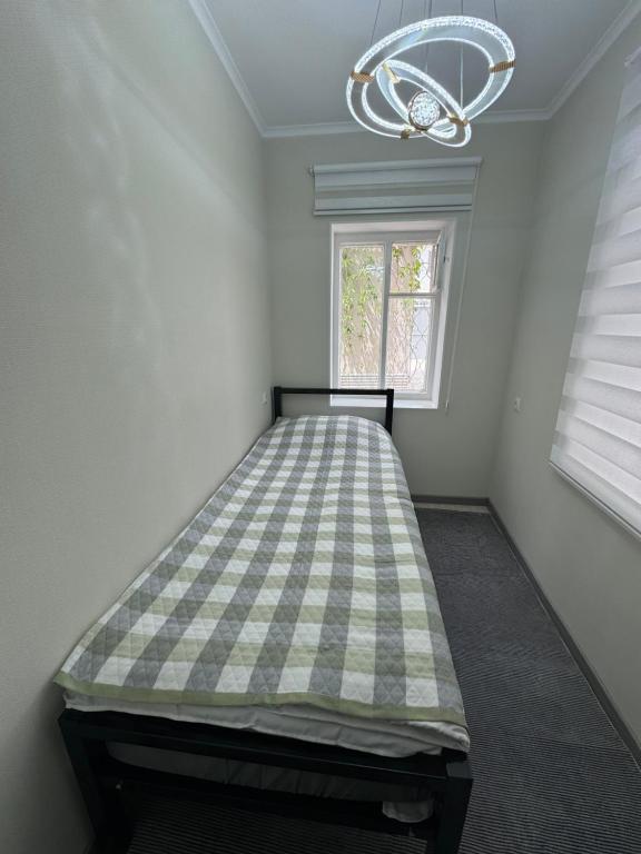 Postel nebo postele na pokoji v ubytování Kosmos