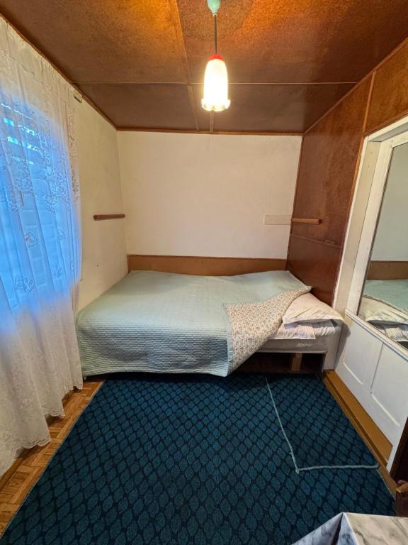 Postel nebo postele na pokoji v ubytování Kosmos
