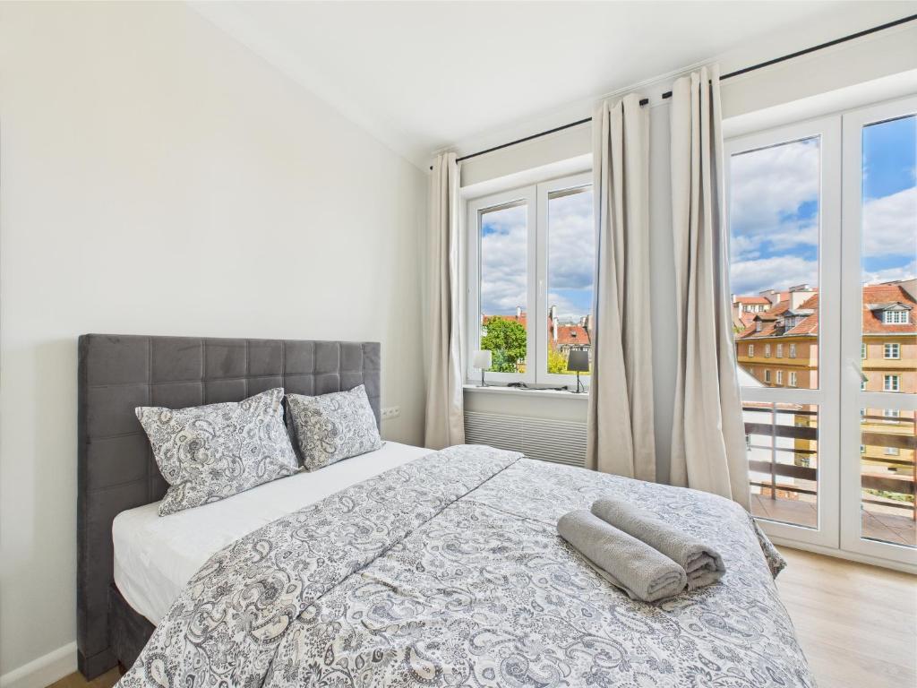 Posteľ alebo postele v izbe v ubytovaní Warsaw Premium Apartments Old Town