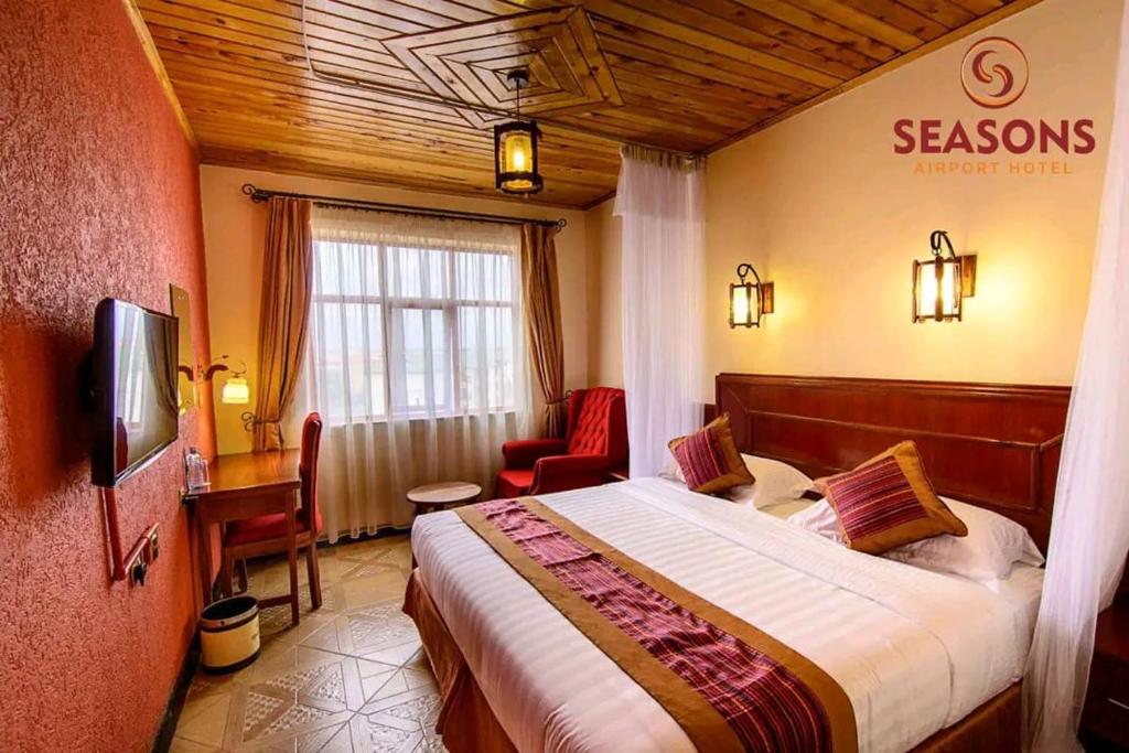 Postel nebo postele na pokoji v ubytování Seasons Airport Hotel, Nairobi