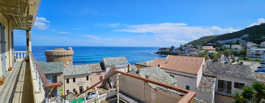 a view of the ocean from a building at Casa Sanna, T2 waterfront Miomo, Cap Corse in Santa-Maria-di-Lota