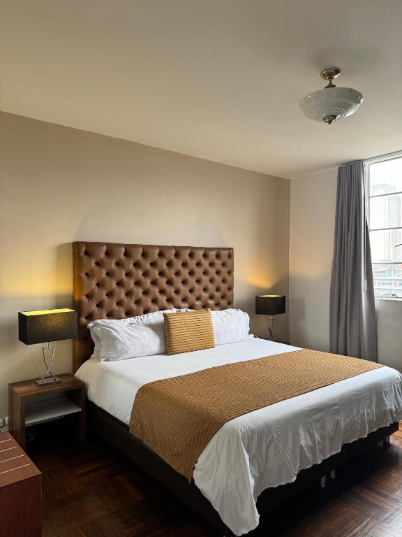 Postel nebo postele na pokoji v ubytování Hotel Nutibara