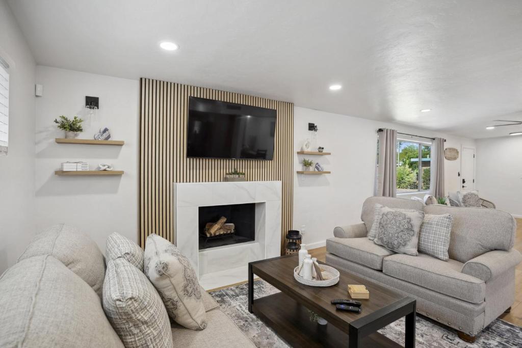 a living room with a couch and a fireplace at Boho on Bermuda By Rather Be Properties in Tucson