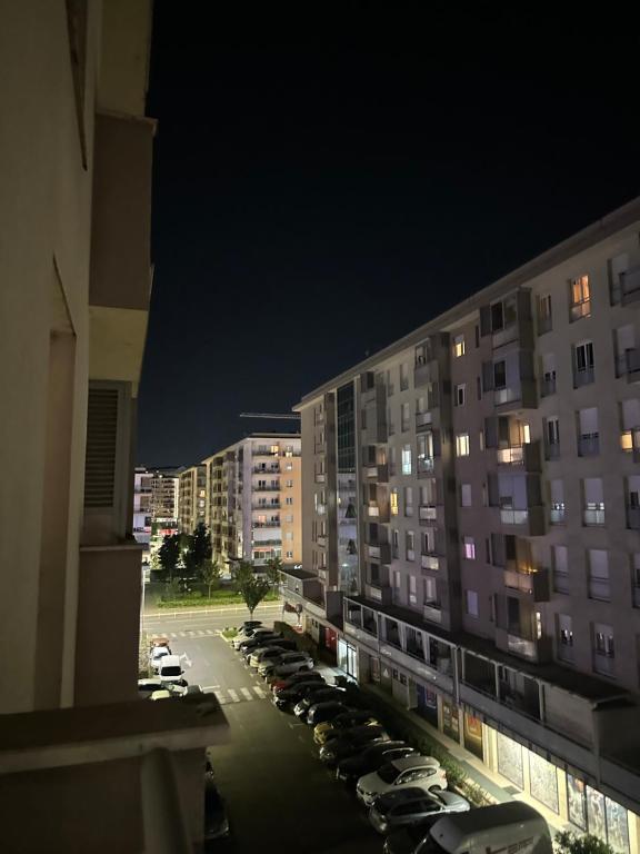 a view of a parking lot in a city at night at District Loft in Podgorica