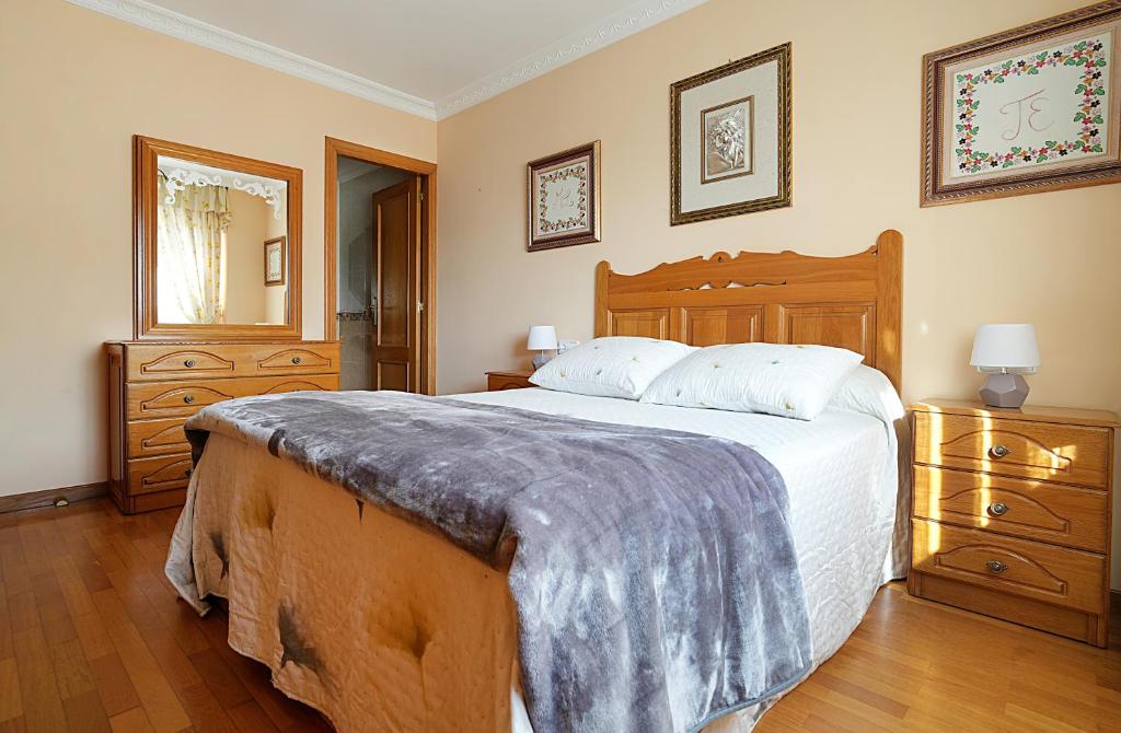 Ένα ή περισσότερα κρεβάτια σε δωμάτιο στο Apartamento As Carolinas