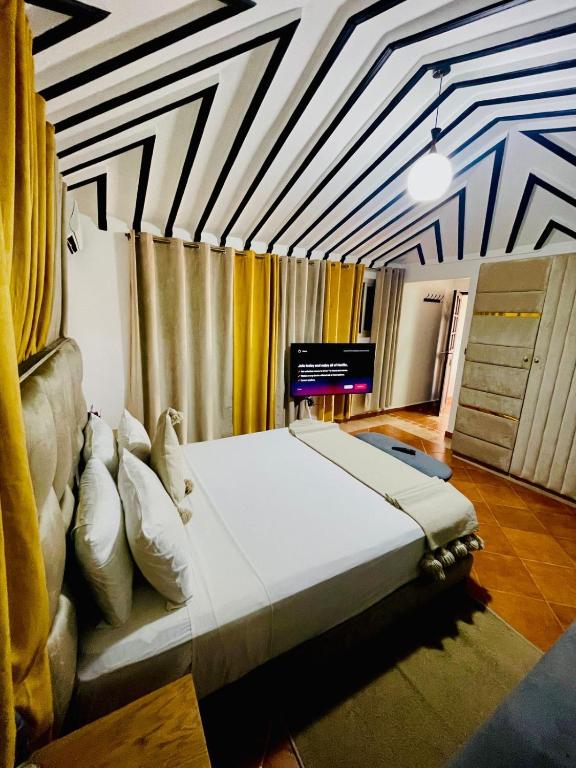 Postel nebo postele na pokoji v ubytování RIAD DOUIRTNA