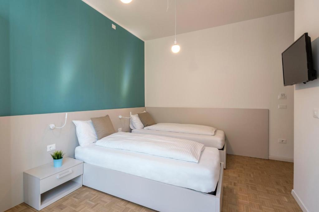 Postel nebo postele na pokoji v ubytování Stay COOPER l Capitol Rooms