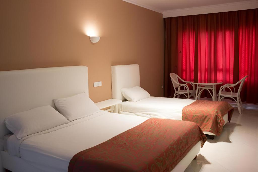 Postel nebo postele na pokoji v ubytování Azayla Hotel