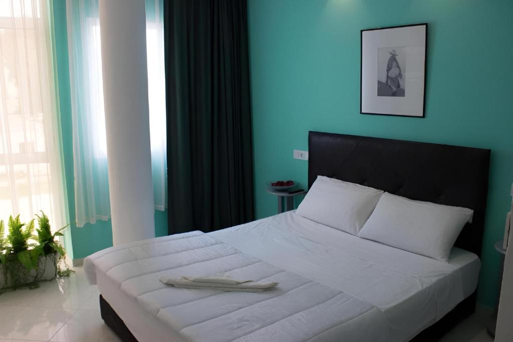 Postel nebo postele na pokoji v ubytování Azayla Hotel