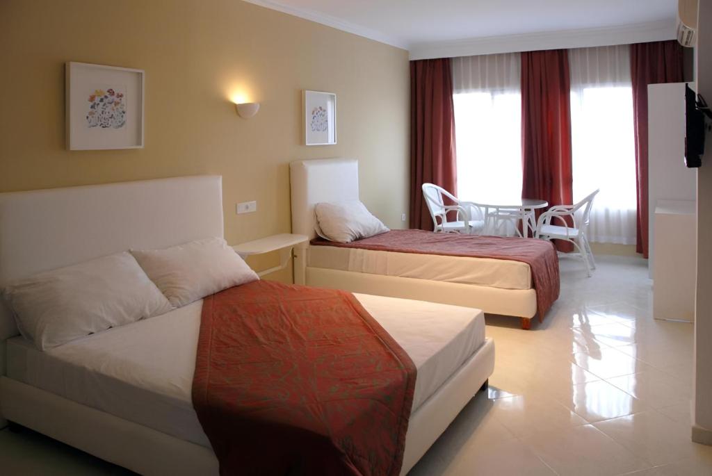 Postel nebo postele na pokoji v ubytování Azayla Hotel