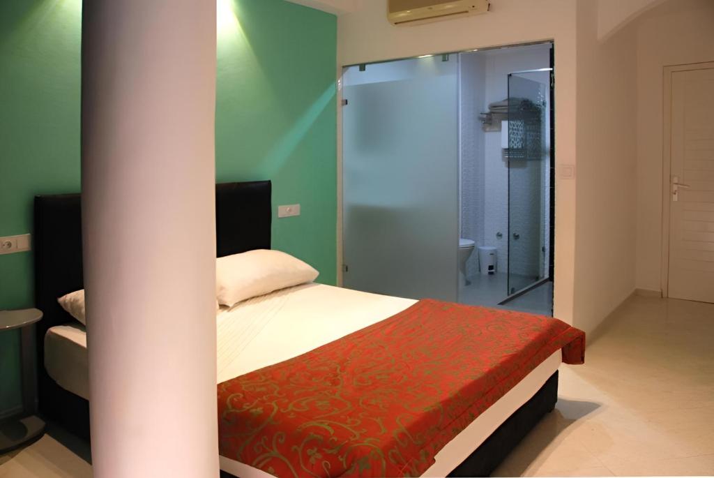 Postel nebo postele na pokoji v ubytování Azayla Hotel