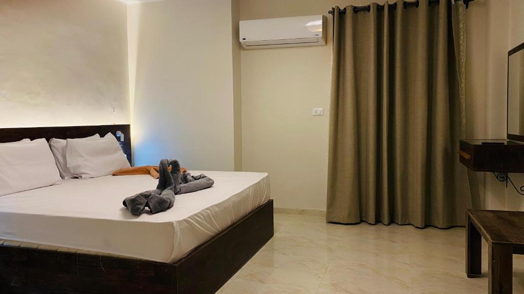 Llit o llits en una habitació de Rivera Hostel