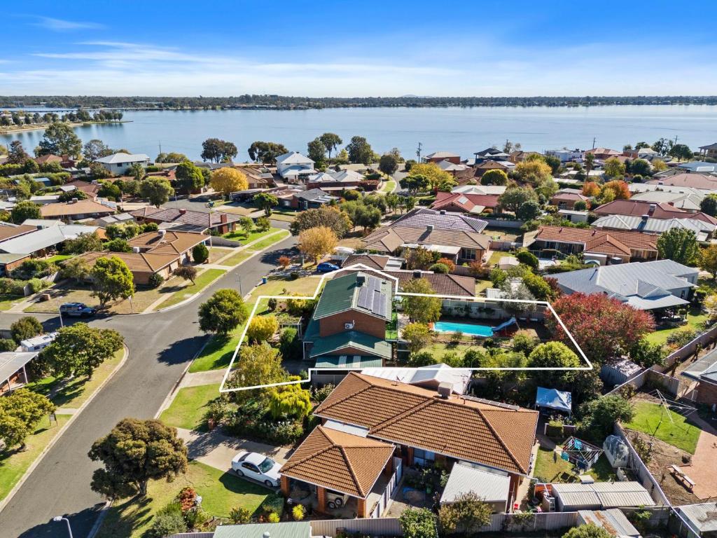 an aerial view of a suburb with a lake at Cade Retreat in Yarrawonga