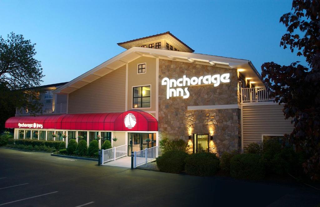 a building with an entrance to an antigobe inn at Anchorage Inn and Suites in Portsmouth