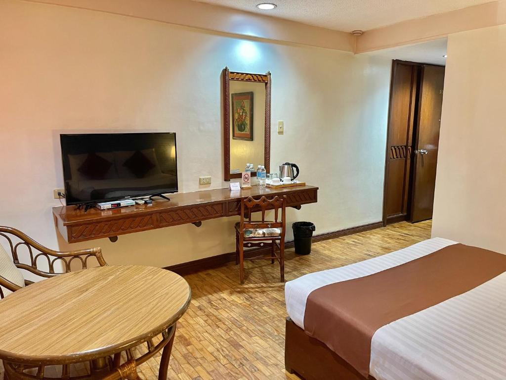 Postel nebo postele na pokoji v ubytování The VIP Hotel