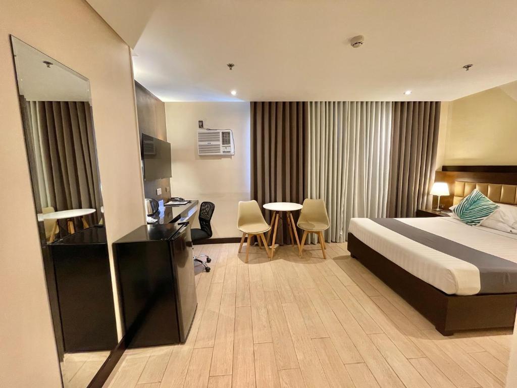 Postel nebo postele na pokoji v ubytování The VIP Hotel