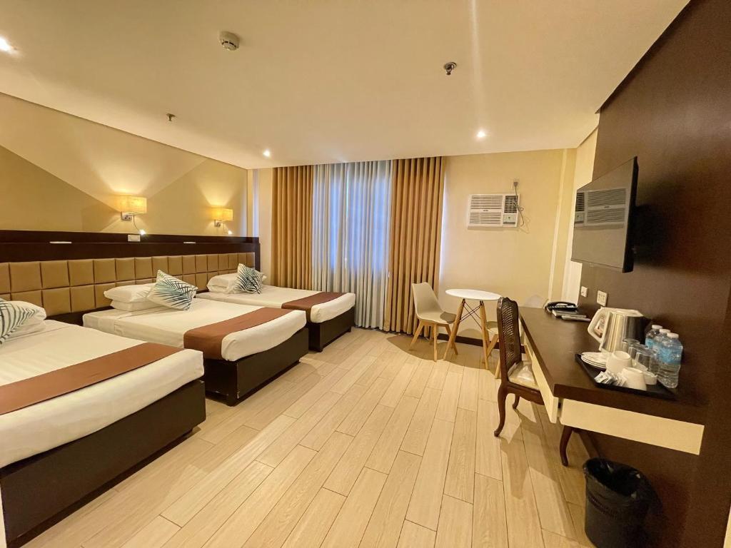 Postel nebo postele na pokoji v ubytování The VIP Hotel