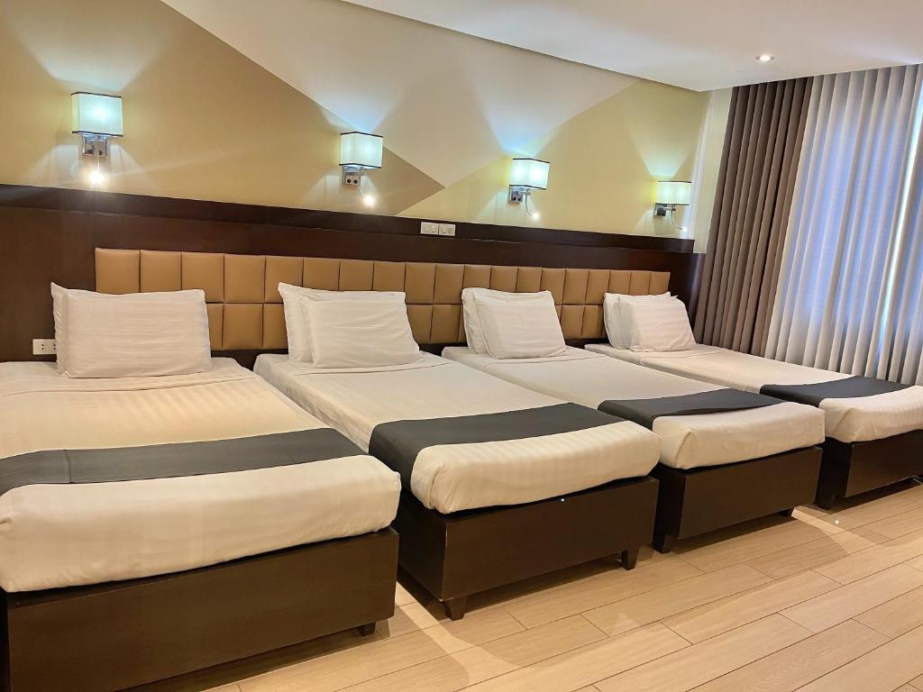 Postel nebo postele na pokoji v ubytování The VIP Hotel