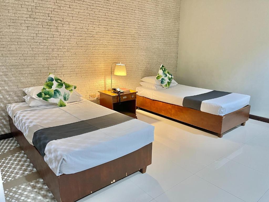 Postel nebo postele na pokoji v ubytování The VIP Hotel
