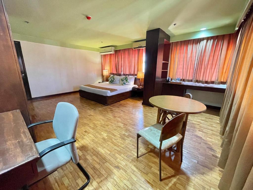 Postel nebo postele na pokoji v ubytování The VIP Hotel