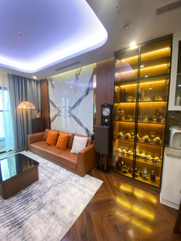 a living room with a couch and a wine cellar at 7Homestay in Hai Phong