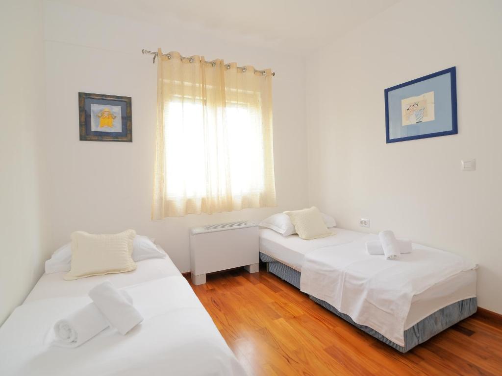 Posteľ alebo postele v izbe v ubytovaní Lavender Suite Zadar