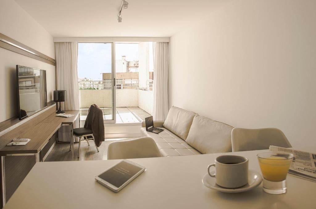 TV a/nebo společenská místnost v ubytování Vivaldi Hotel Loft Punta Carretas