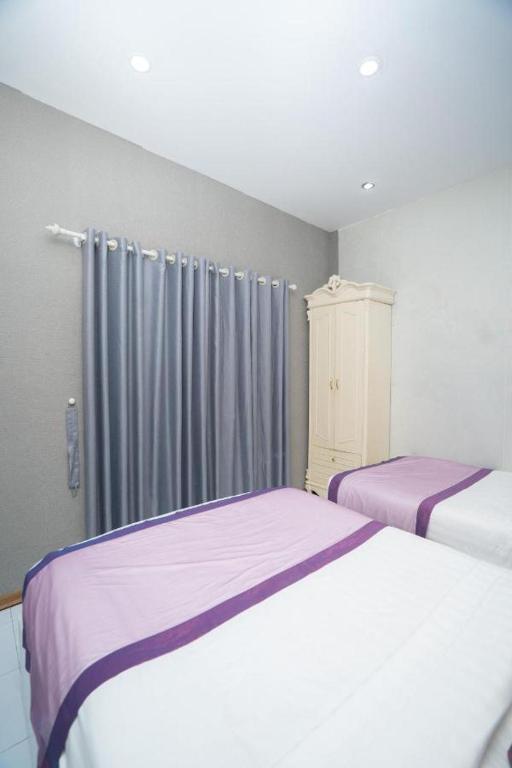 Postel nebo postele na pokoji v ubytování Hanoi 0riental Hotel