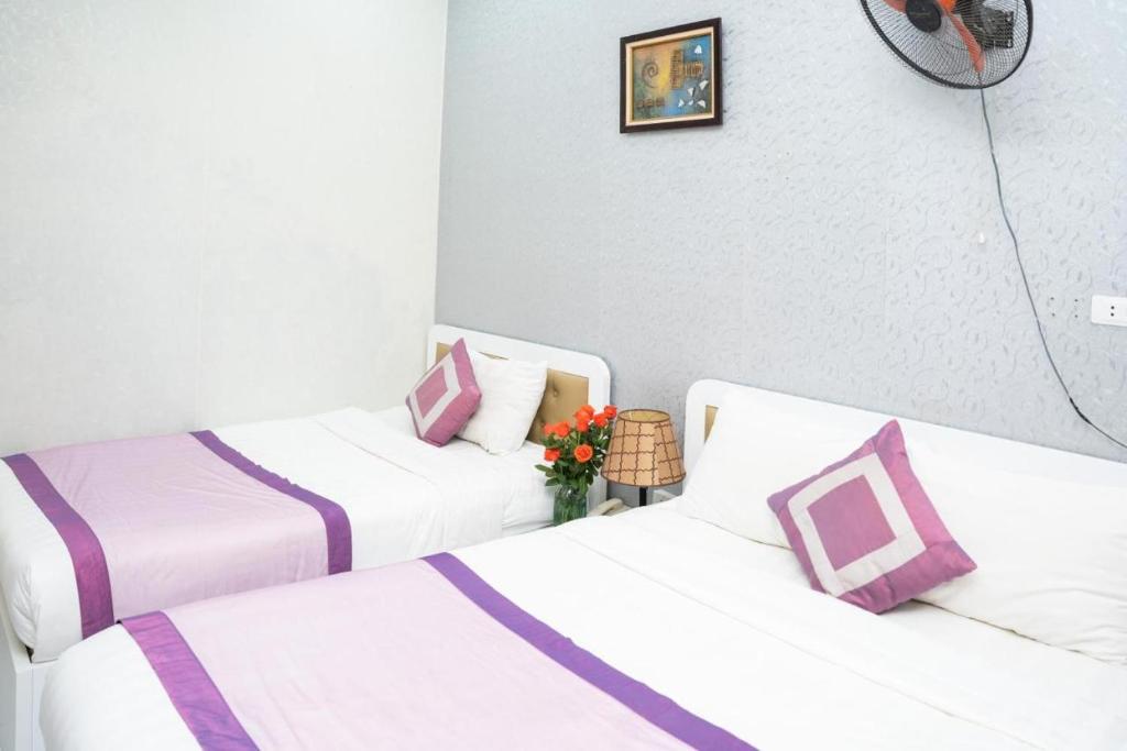 Postel nebo postele na pokoji v ubytování Hanoi 0riental Hotel