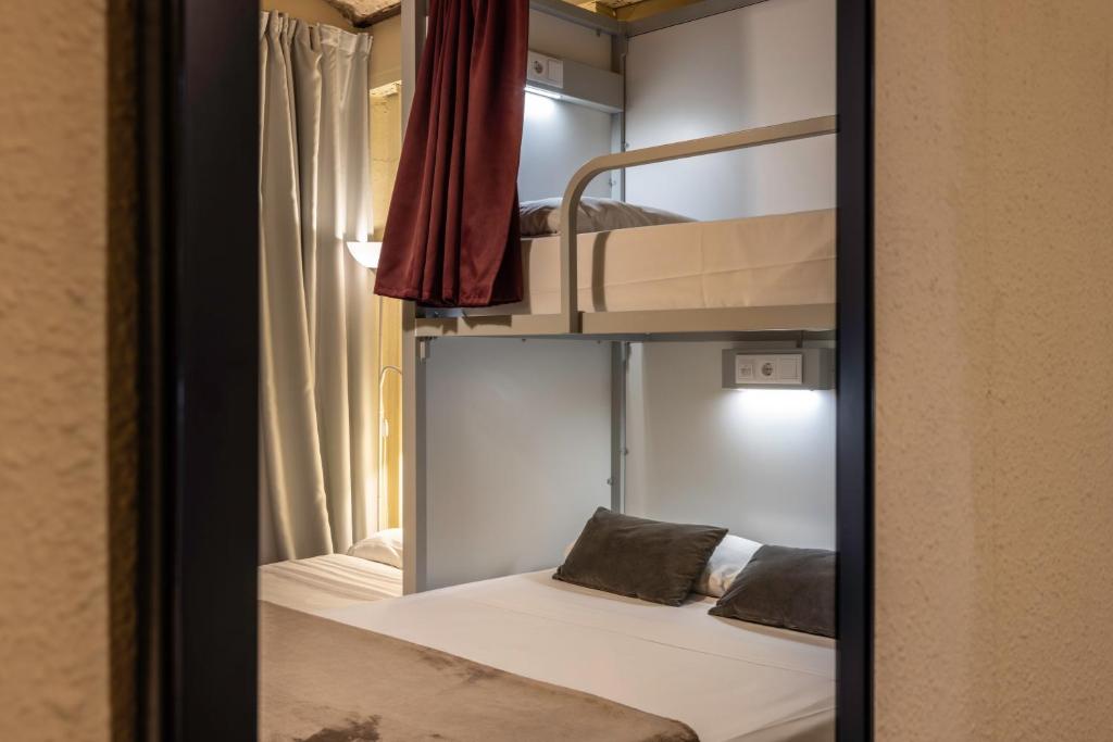 Cama ou camas em um quarto em The Loft House Barcelona