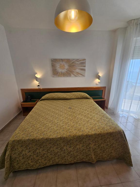 Postel nebo postele na pokoji v ubytování Hotel Neptunus