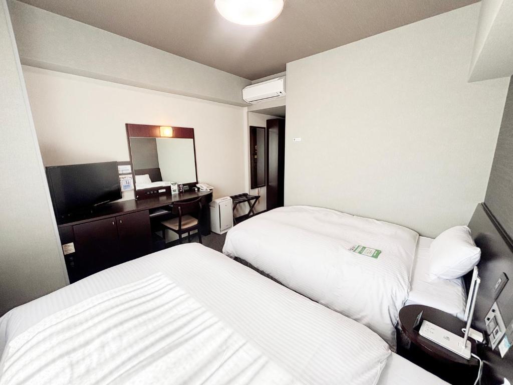 TV a/nebo společenská místnost v ubytování Hotel Route-Inn Iyo-Saijo