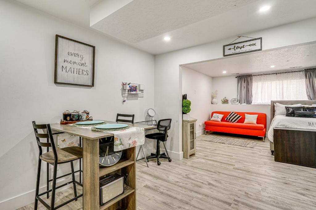 a bedroom with a bed and a desk in a room at Cozy Studio Retreat in Salt Lake City Area! in Magna
