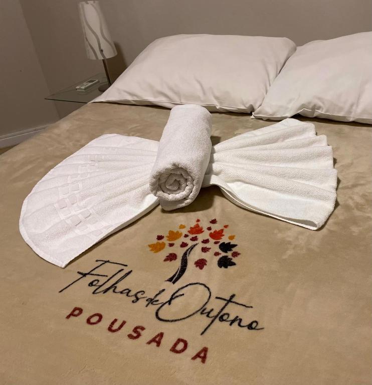 Postel nebo postele na pokoji v ubytování Pousada Folhas de Outono