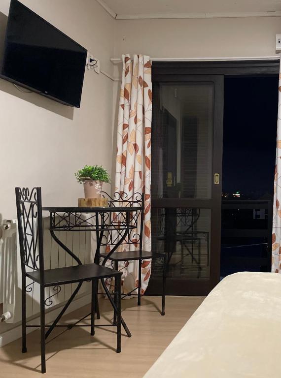 TV a/nebo společenská místnost v ubytování Pousada Folhas de Outono