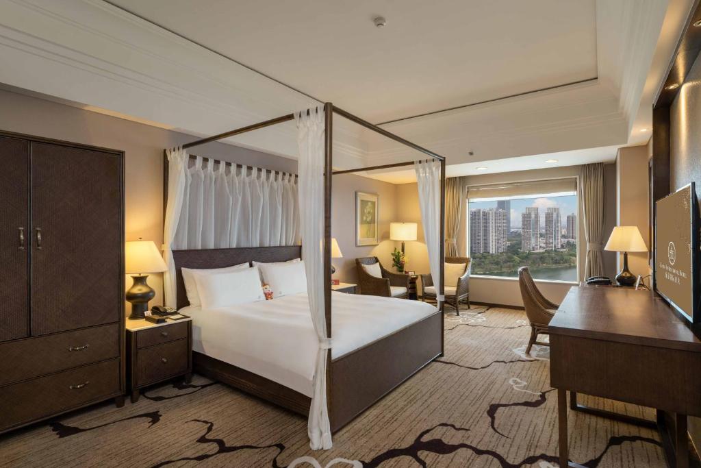 Postel nebo postele na pokoji v ubytování Huizhou Kande International Hotel