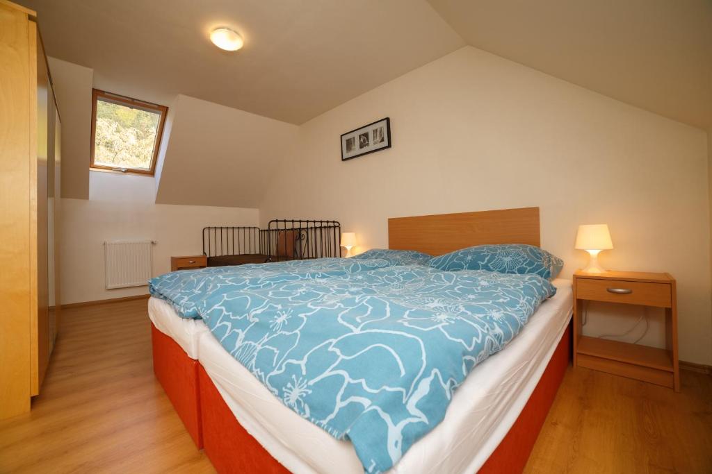 Postel nebo postele na pokoji v ubytování Apartmánový Dom River