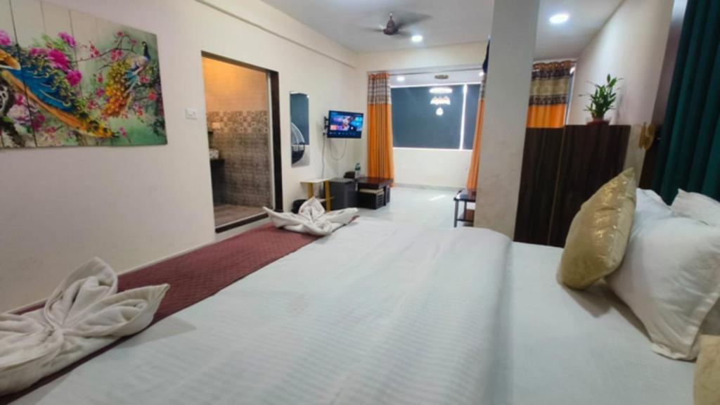 Postel nebo postele na pokoji v ubytování Hotel Small Daddy Plus