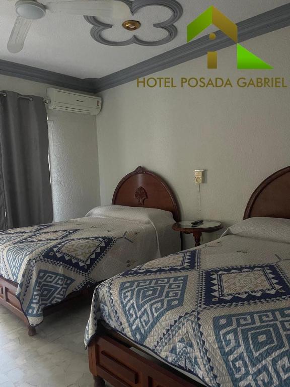Postel nebo postele na pokoji v ubytování Hotel Posada Gabriel