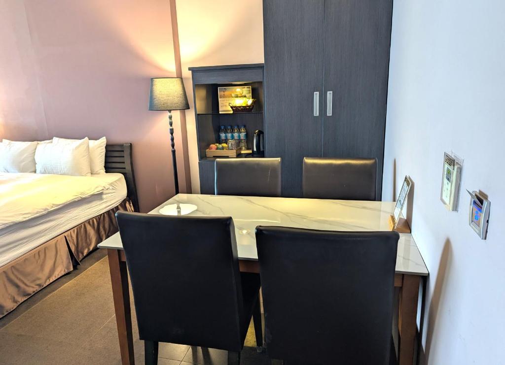 Postelja oz. postelje v sobi nastanitve Jing Guan Hotel