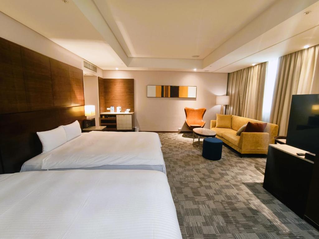 Postel nebo postele na pokoji v ubytování Via Hotel Breeze