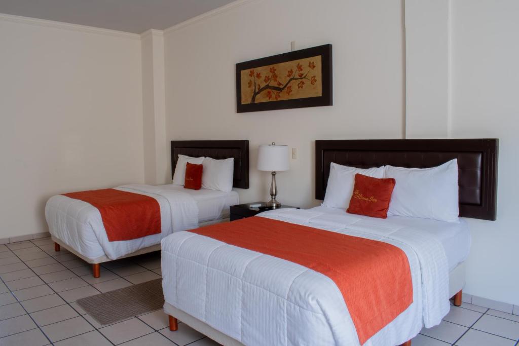 Postel nebo postele na pokoji v ubytování Hotel Aliana