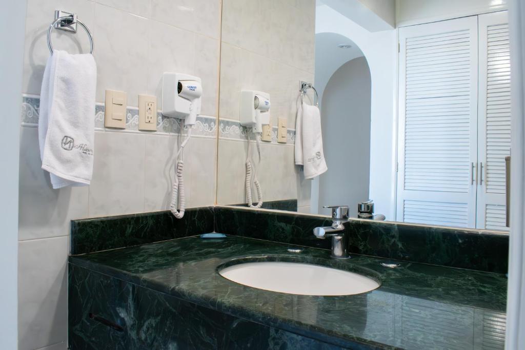 Koupelna v ubytování Hotel Aliana