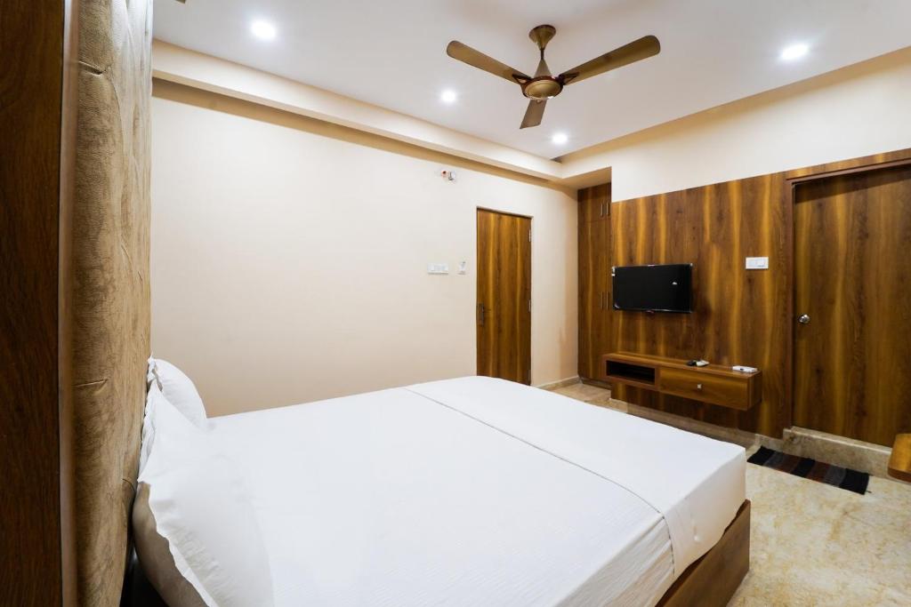 Postel nebo postele na pokoji v ubytování Hotel O GM