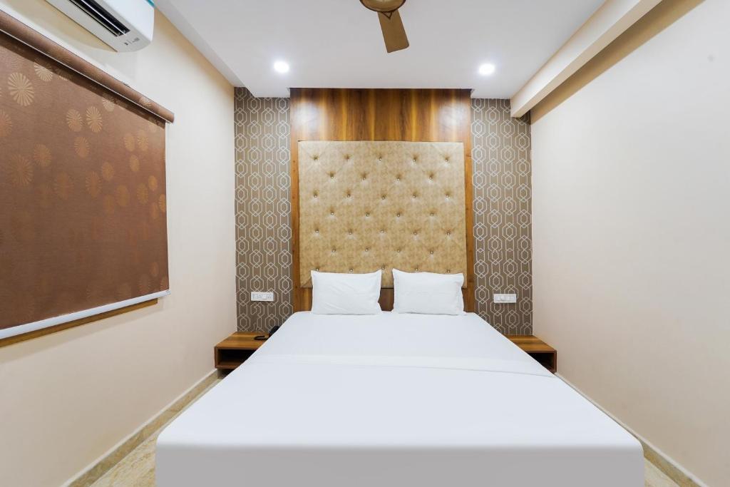 Postel nebo postele na pokoji v ubytování Hotel O GM