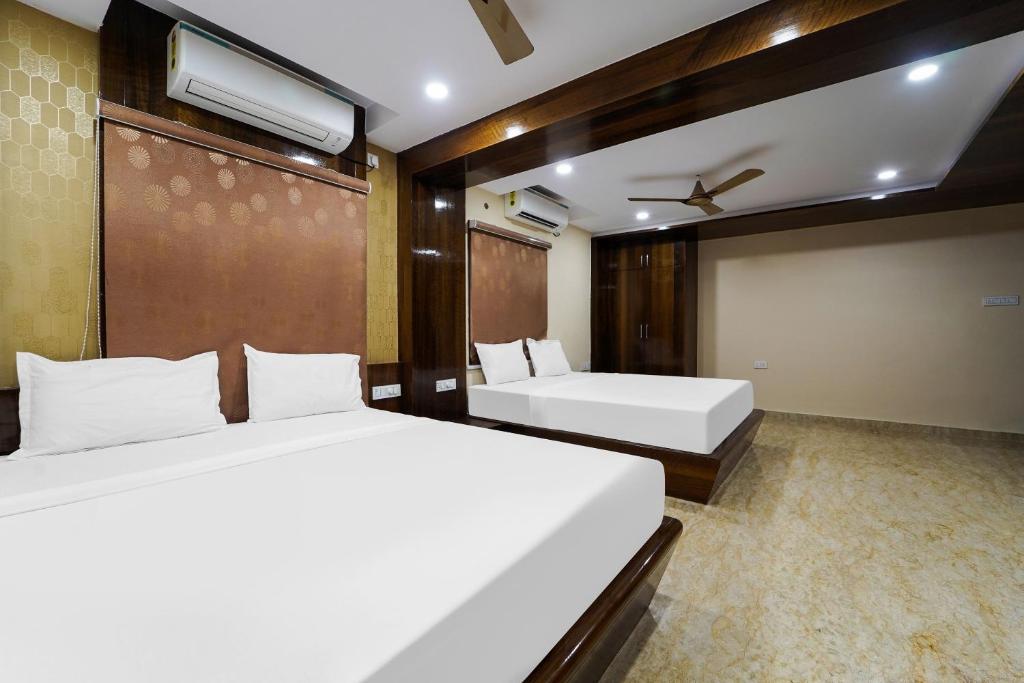 Postel nebo postele na pokoji v ubytování Hotel O GM