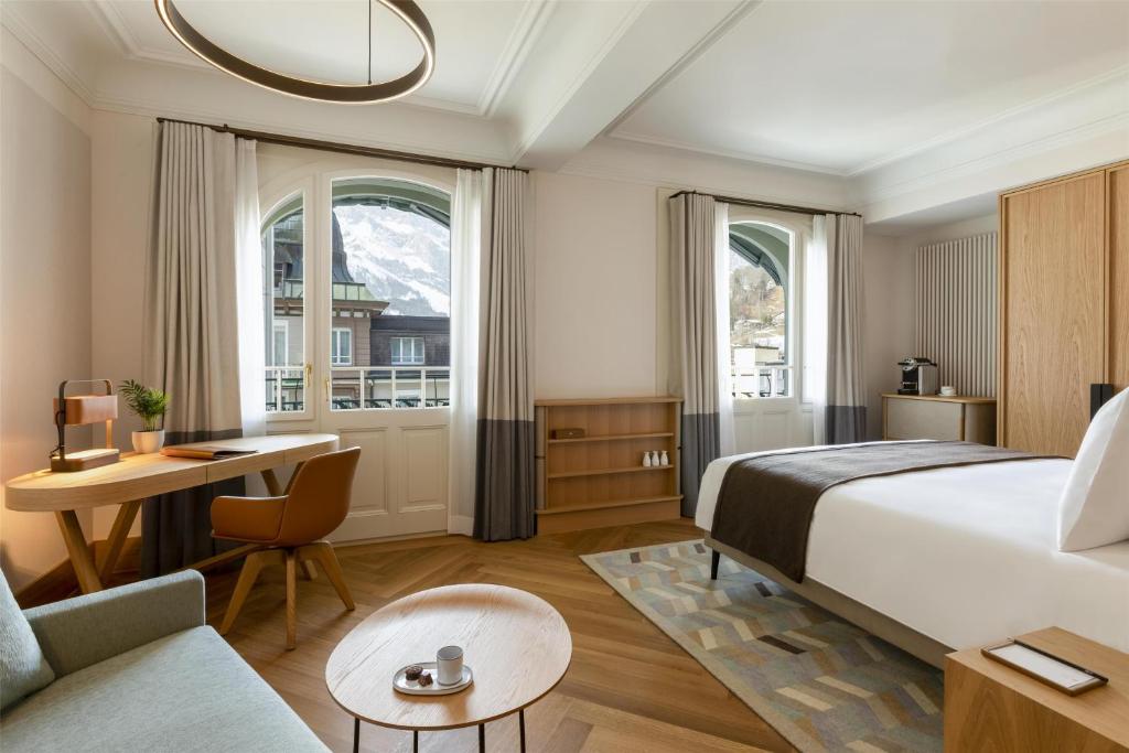 Letto o letti in una camera di Kempinski Palace Engelberg