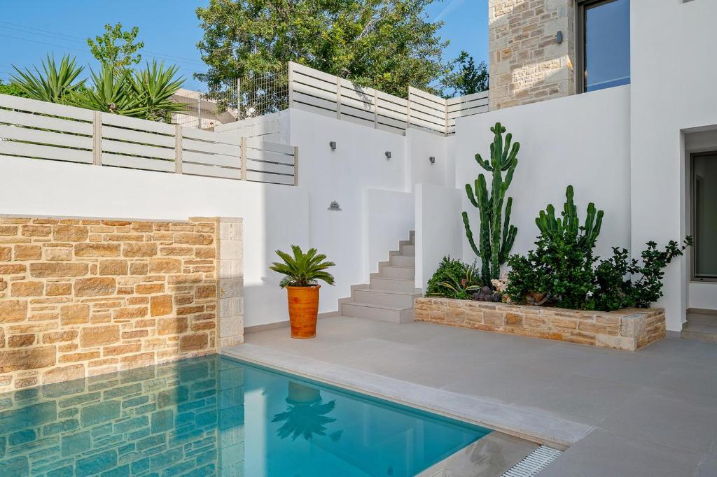 The swimming pool at or close to Ammokrinos Luxury Homes, 150m From Sea
