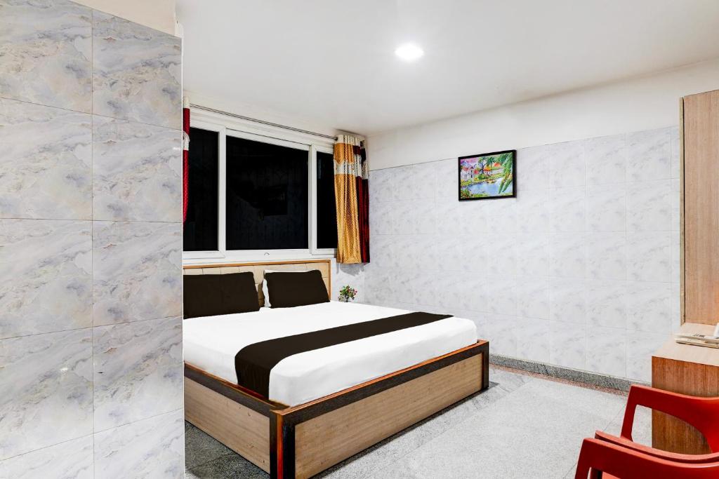 Postel nebo postele na pokoji v ubytování Super Hotel O Arcot Road Porur